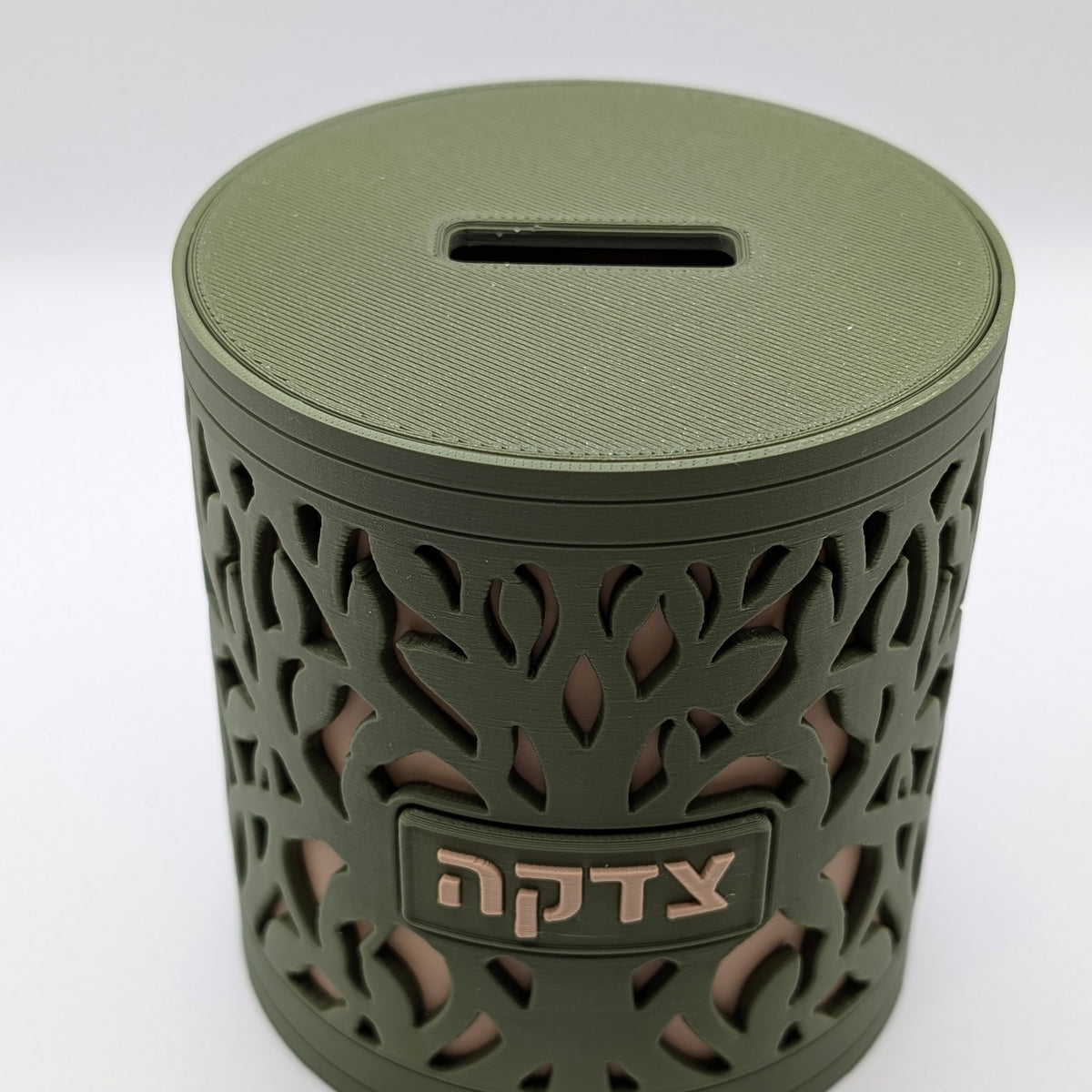 Tree of Life tzedakah box from a slight angle, slot in the lid