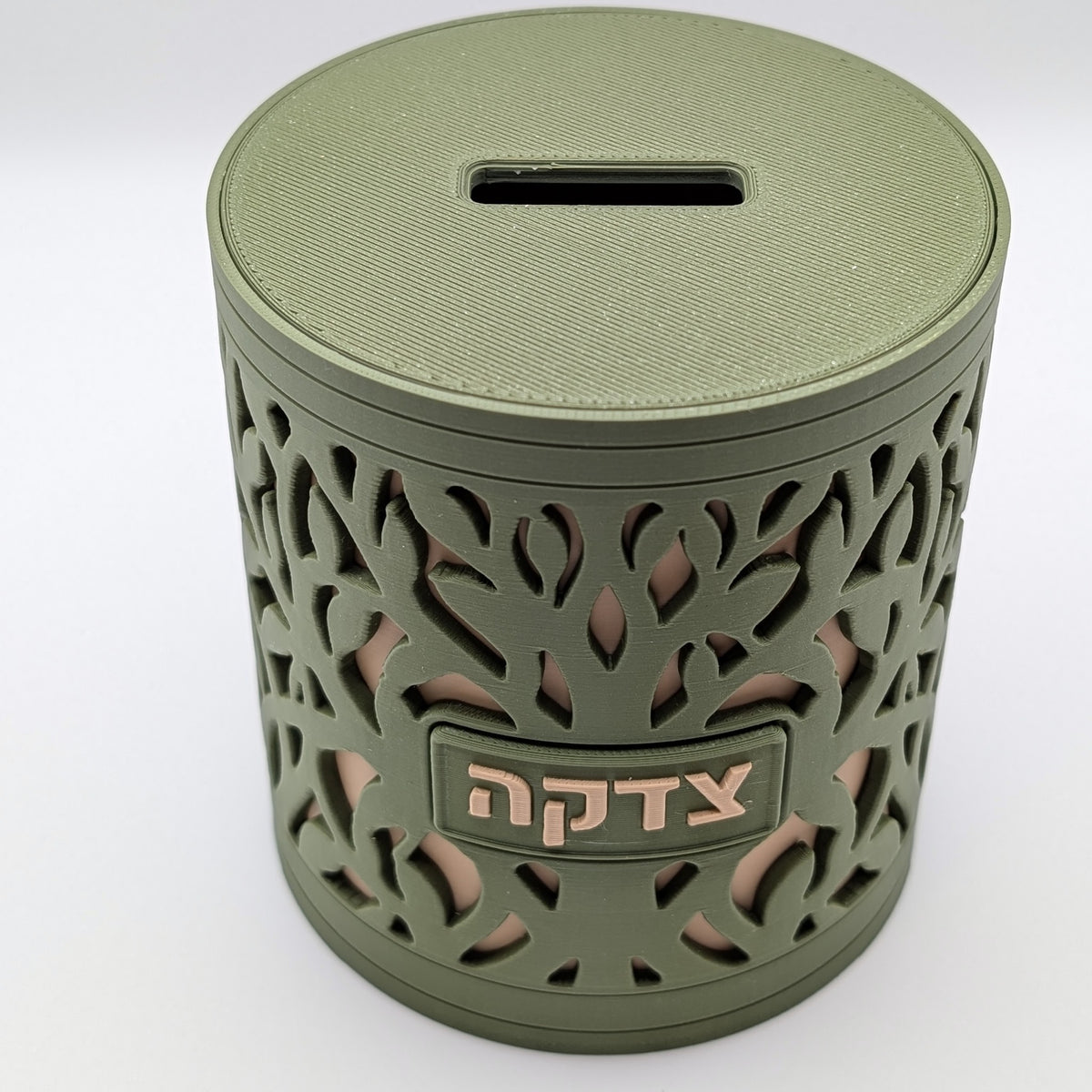 Tree of Life tzedakah box seen from above, lid and slot